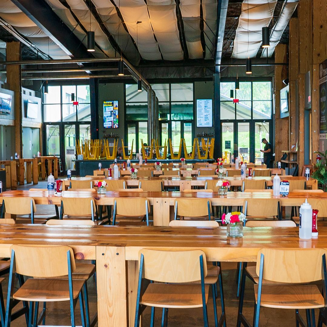 The Charlottesville dining hall: long wooden tables under tall windows
